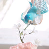 Bluebirds dressing cake mid air - Tuck Box Cakes