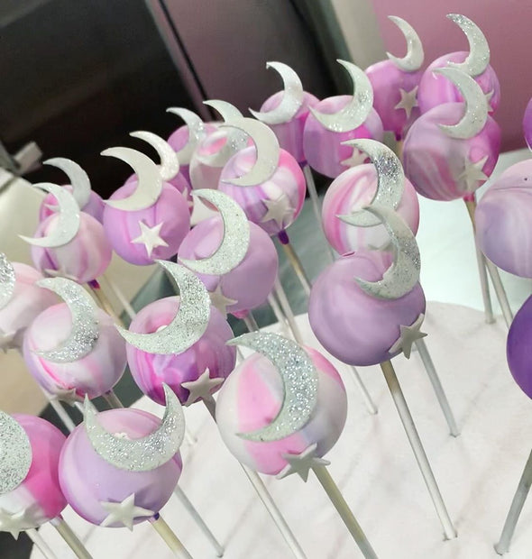 Pink and purple moon and star cake pops - Tuck Box Cakes