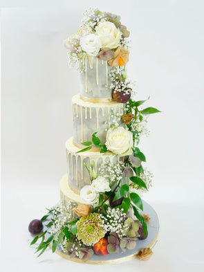 Grey drip cake decorated with fresh flowers - Tuck Box Cakes