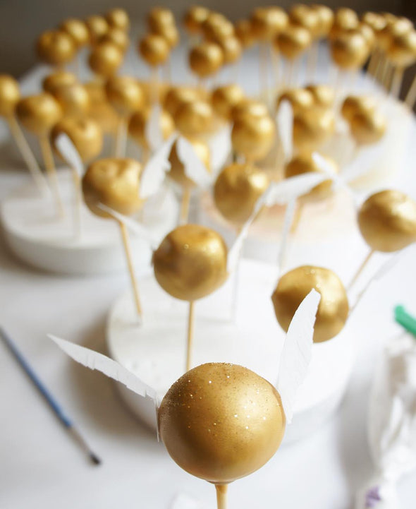 Golden Snitch cake pops - Tuck Box Cakes